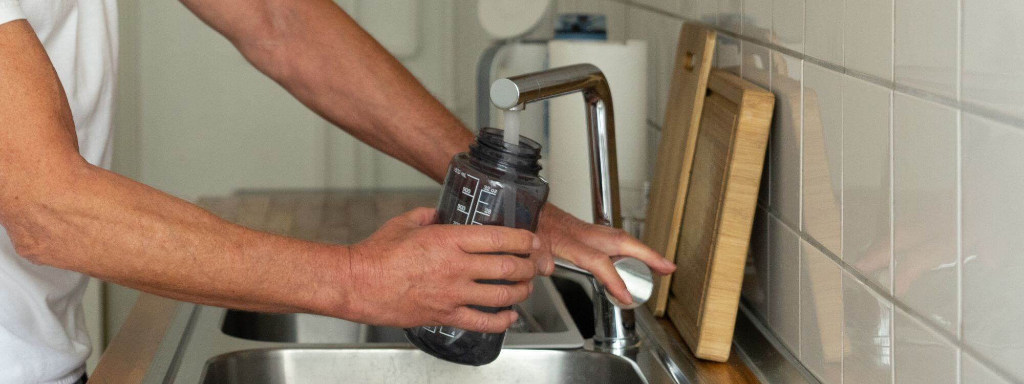 Washing reusable water bottle in the sink