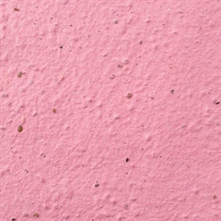 four hand-crafted seed bombs made from recycled paper in pink.