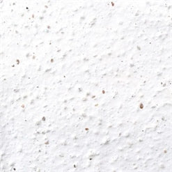 four hand-crafted seed bombs made from recycled paper in white.