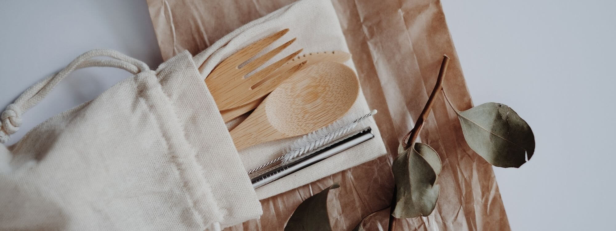 reusable bamboo eating utensils and stainless steel straw