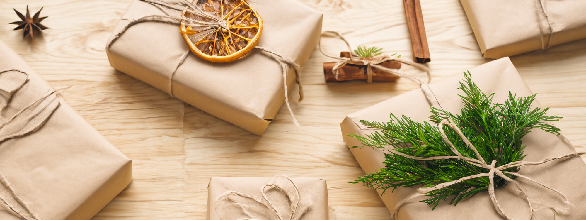 gift wrapped with red bow on a wooden back drop