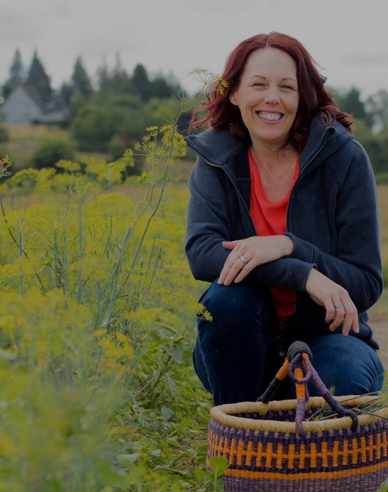 Our founder and CEO, Stacee Matheson, in a beautiful field of flowers.