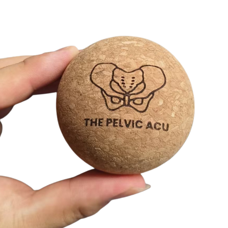 hand holding 2.5 inch cork massage ball